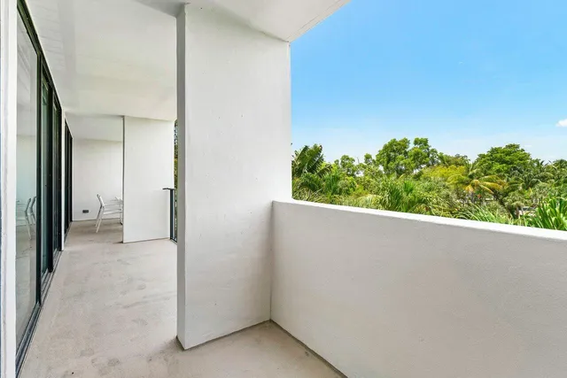 view of a room with a tree in the background