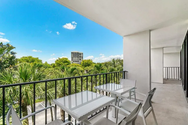 a view of a balcony with furniture