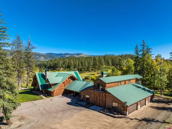 a view of a chairs and table in the patio