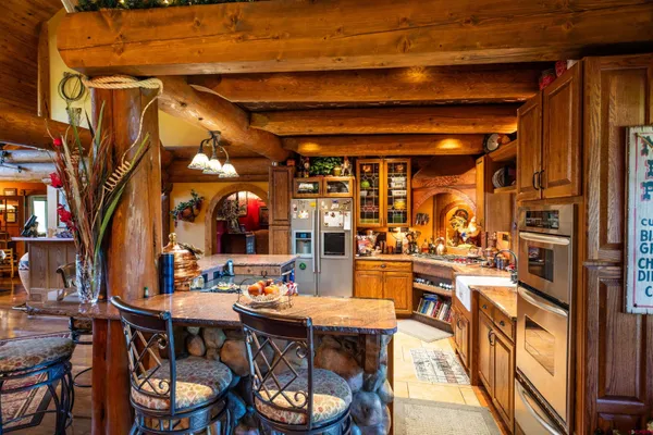 a view of a dinning table and chairs in the patio
