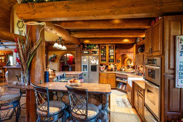 a view of a dinning table and chairs in the patio