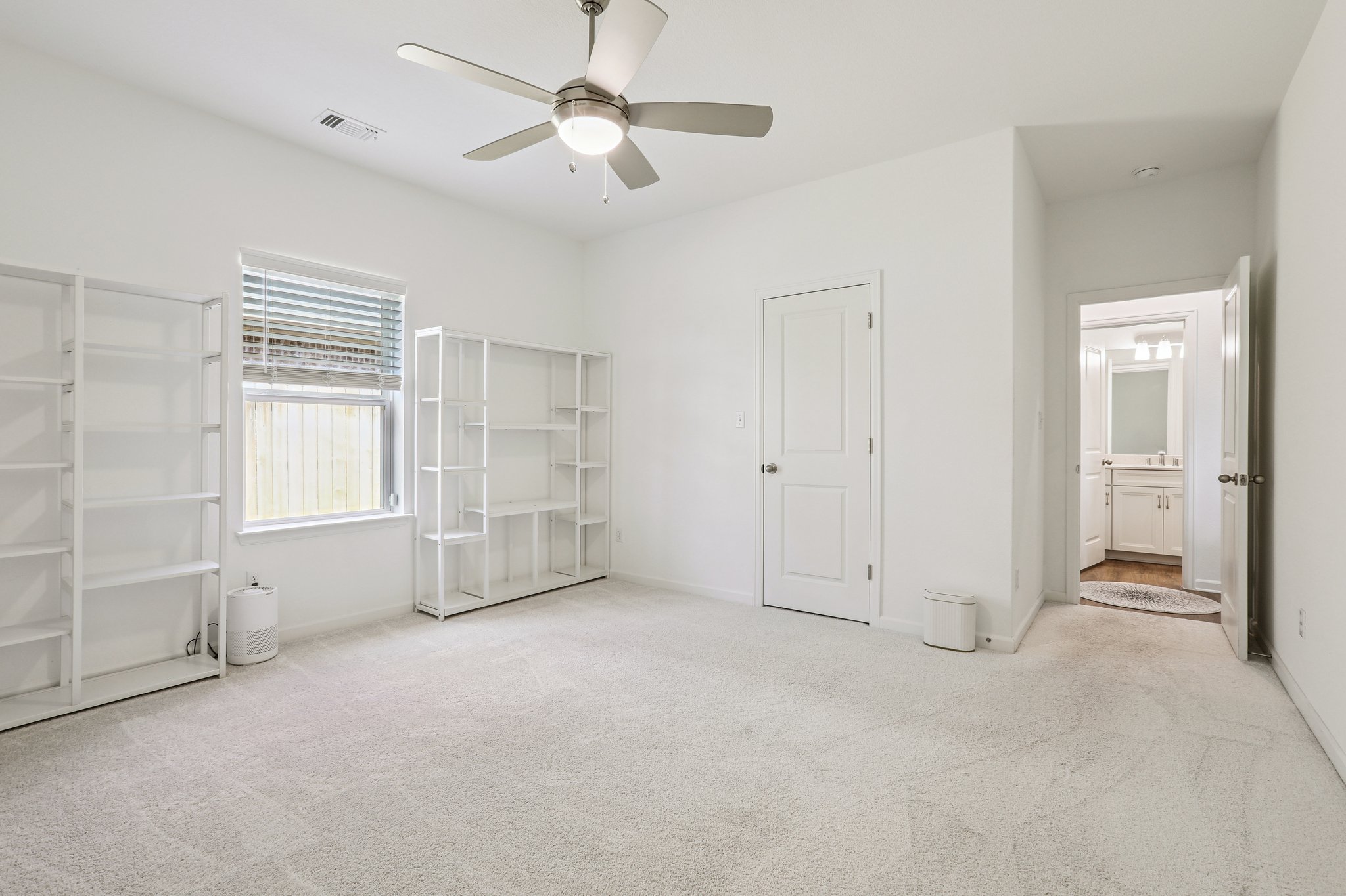 1102 Simmental Loop Hutto, TX 78634 - Photo 16 of 29 a view of an empty room with a window