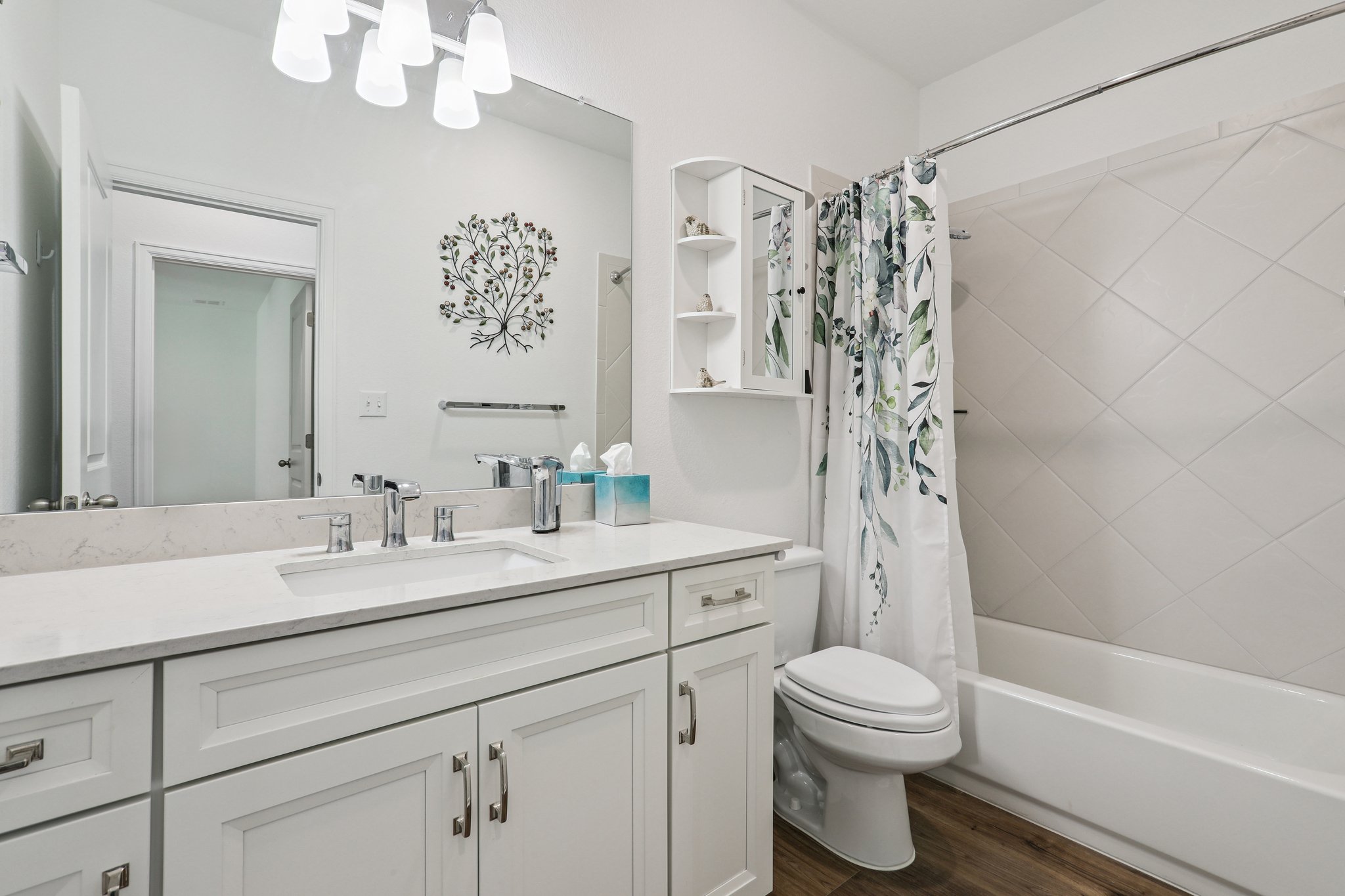 1102 Simmental Loop Hutto, TX 78634 - Photo 17 of 29 a bathroom with a sink a toilet and a bathtub