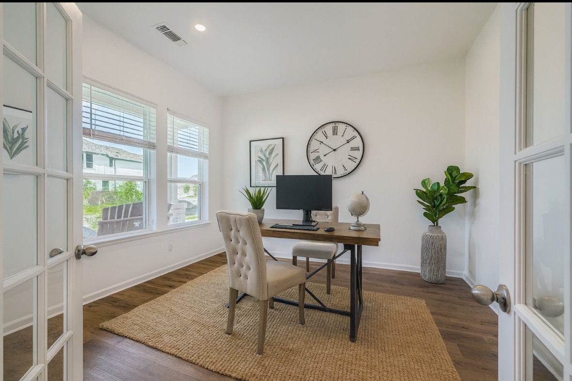 1102 Simmental Loop Hutto, TX 78634 - Photo 4 of 29 a view of a dining room with furniture window and wooden floor