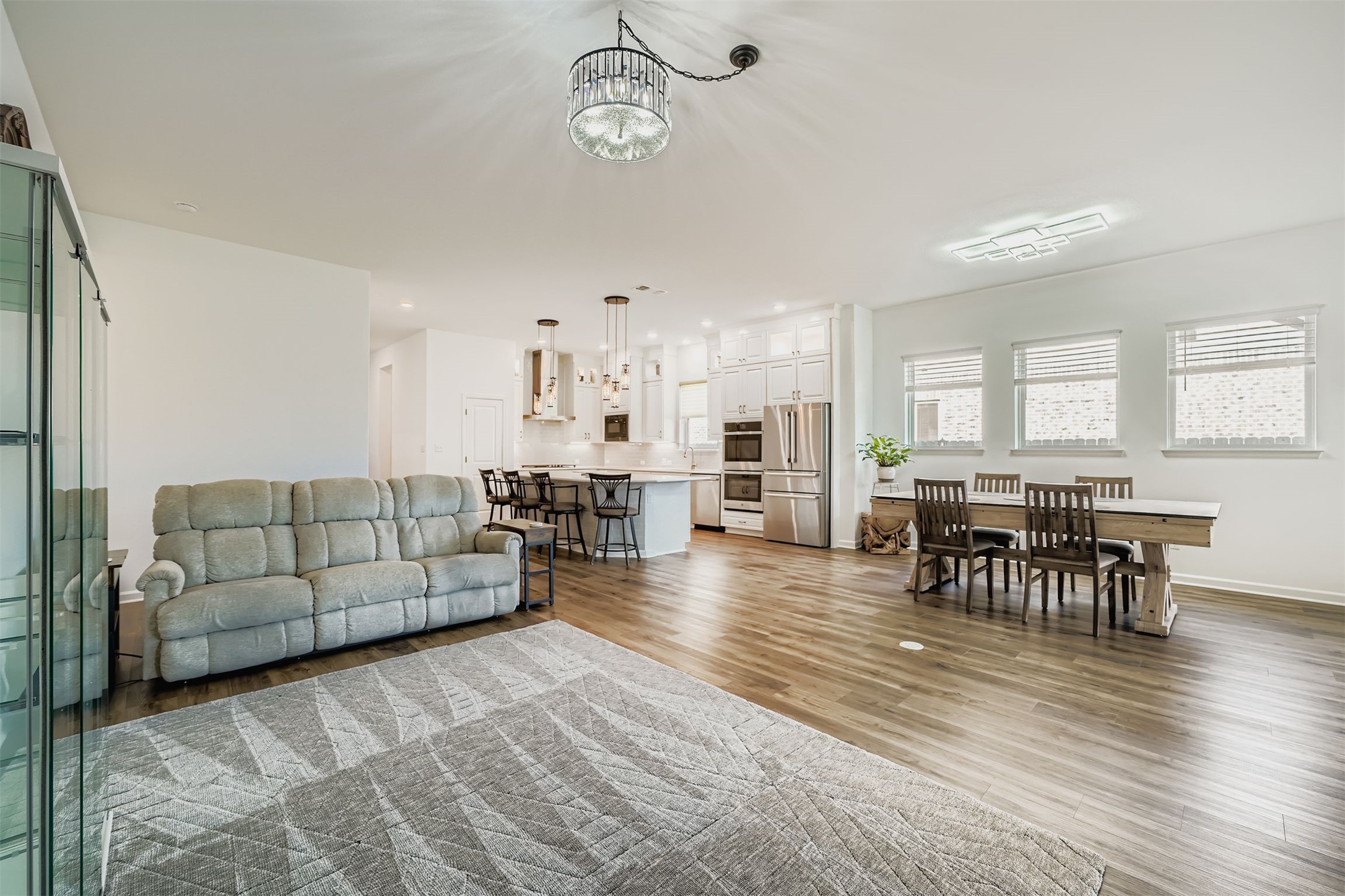 1102 Simmental Loop Hutto, TX 78634 - Photo 10 of 29 a living room with furniture wooden floor and kitchen view