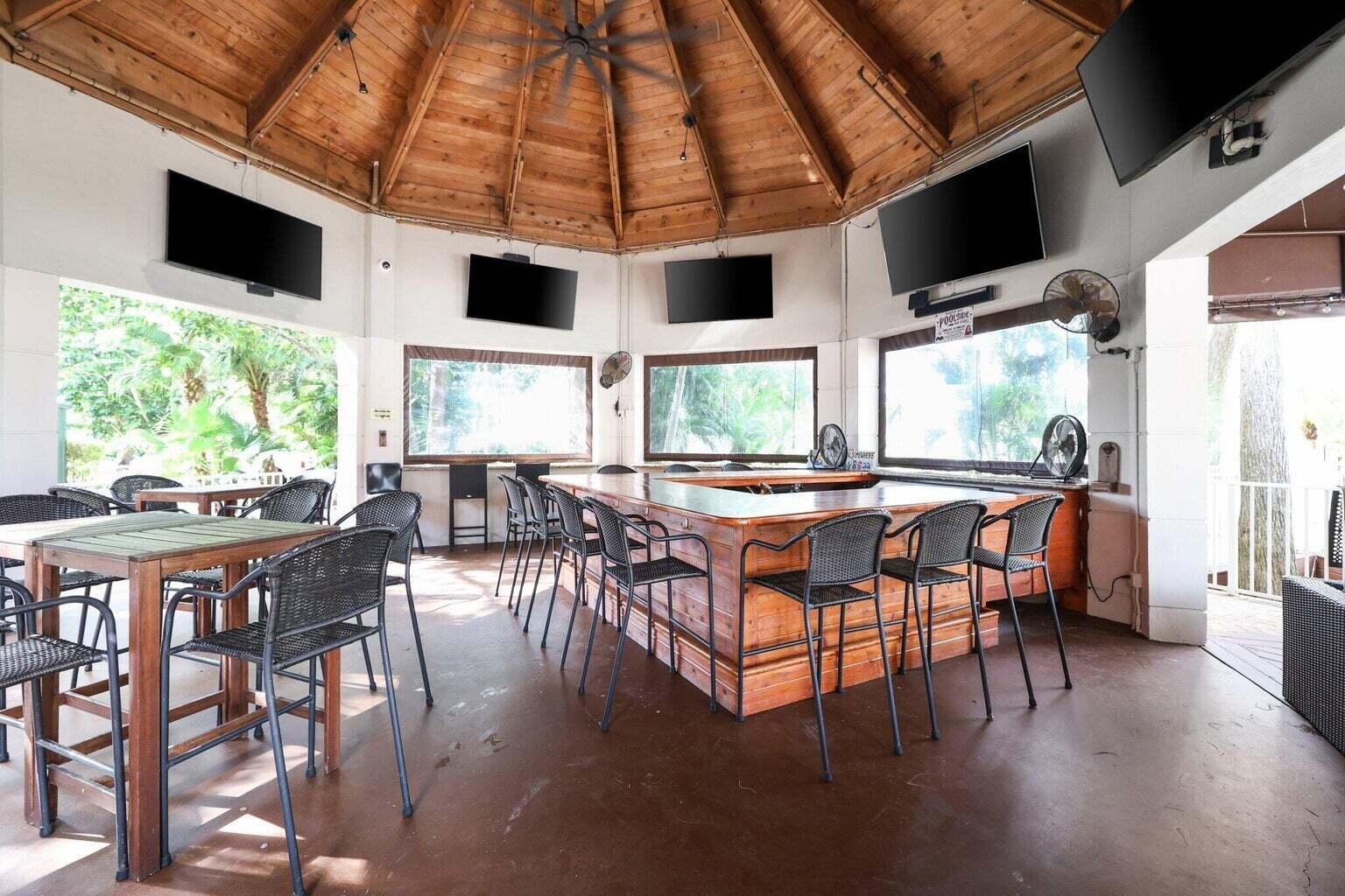 10762 Santa Rosa Drive Boca Raton, FL 33498 - Photo 53 of 64 a dining room with furniture window and wooden floor