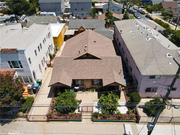 an aerial view of a house with a yard