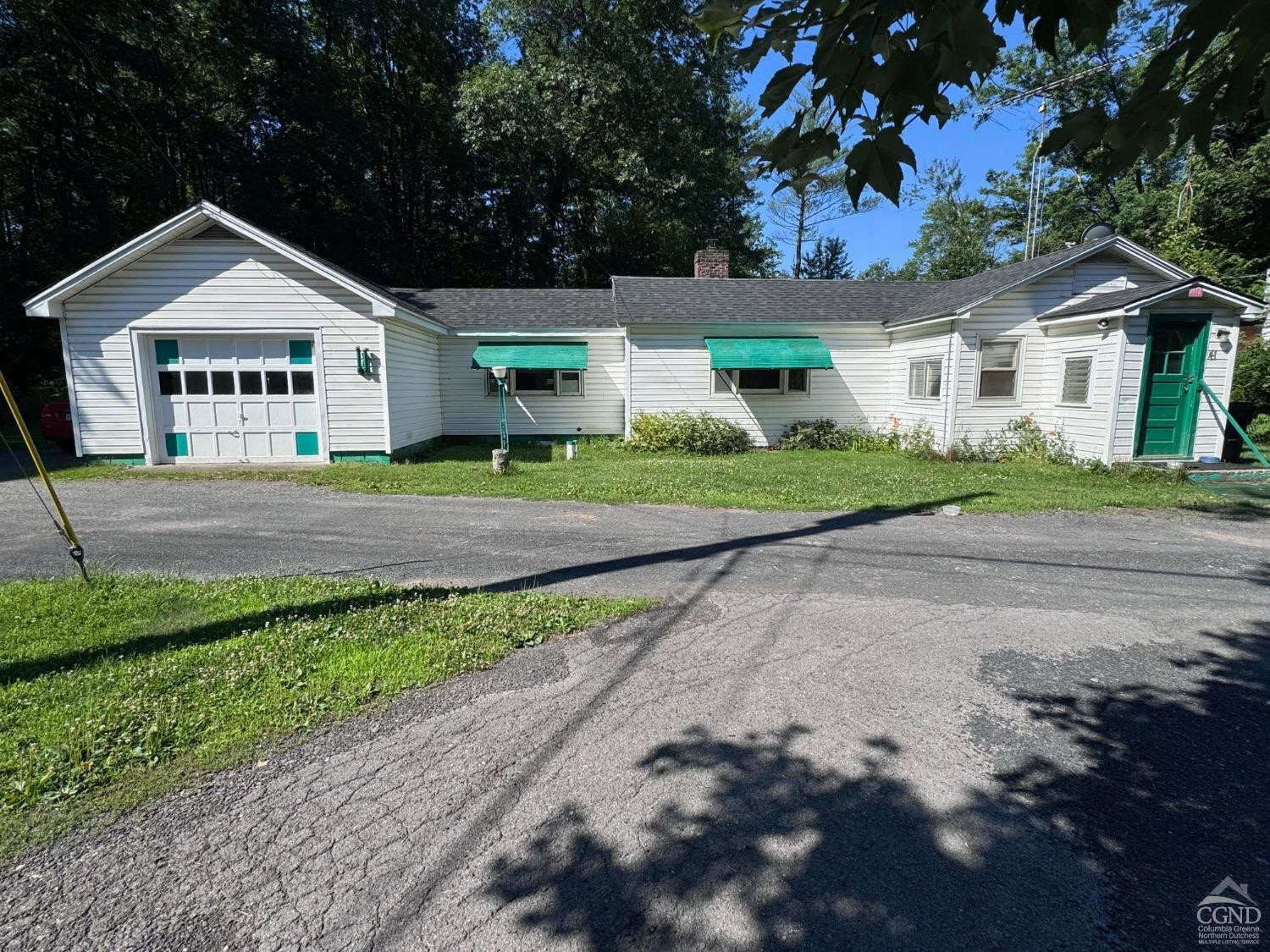 41 Dalton Road Cairo, NY 12413 - Photo 1 of 12 a front view of a house with a yard and garage