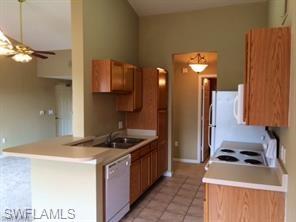 a kitchen that has a sink and a stove