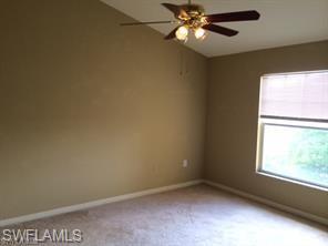 7940 Preserve Circle, Unit 935 Naples, FL 34119 - Photo 5 of 8 an empty room with a window and a fan