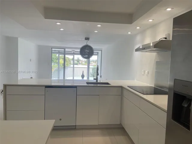 a kitchen with a sink and cabinets