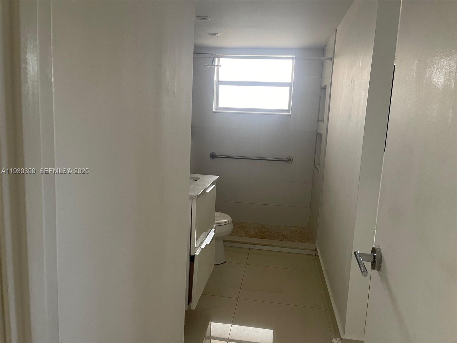 1670 Northeast 191st Street, Unit 2133 Miami, FL 33179 - Photo 15 of 15 a bathroom with a toilet