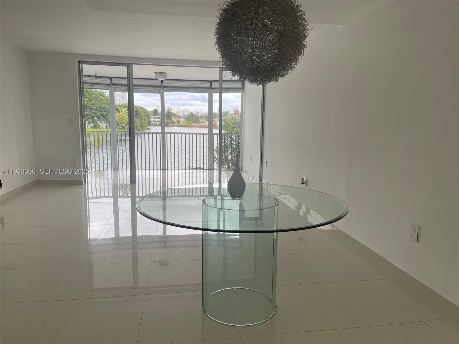 1670 Northeast 191st Street, Unit 2133 Miami, FL 33179 - Photo 2 of 15 a vase of flowers sitting on a table