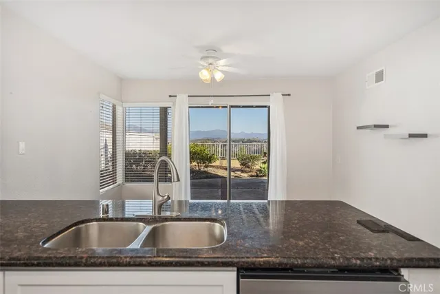 a view of an empty room with glass door