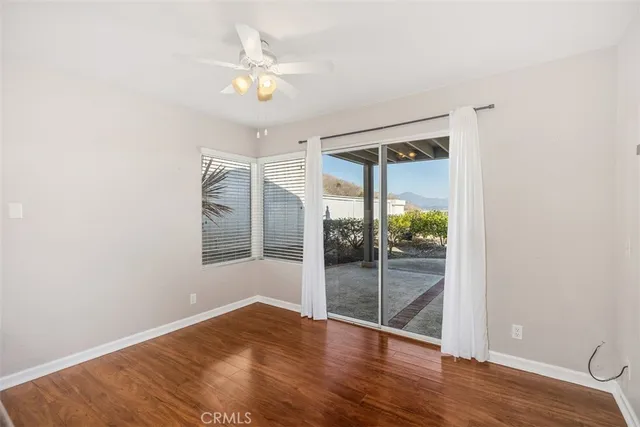 a kitchen with granite countertop a stove a sink and a refrigerator