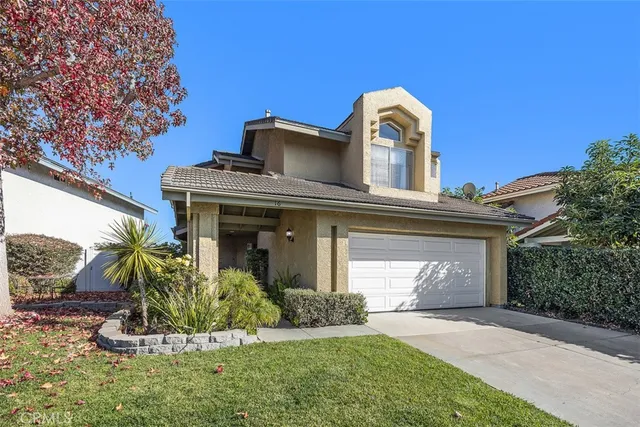 a view of a front of a house with a yard