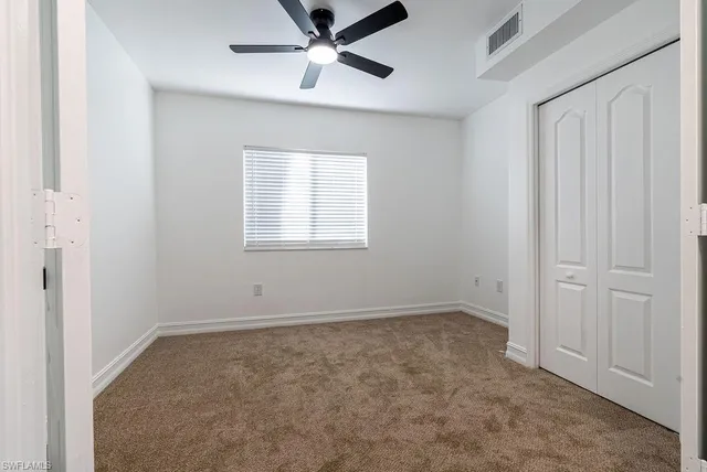 an empty room with fan