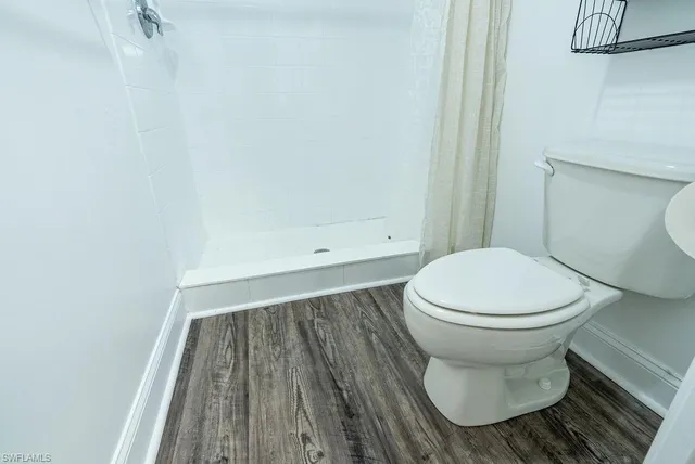 a bathroom with a toilet and a sink