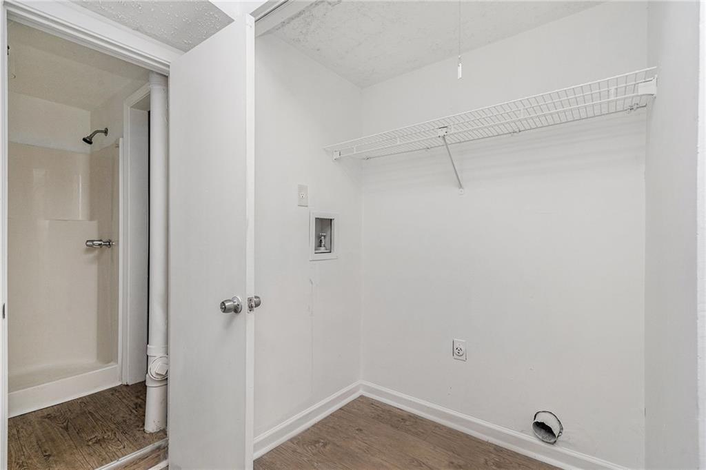 5444 Wylstream Way Norcross, GA 30093 - Photo 11 of 12 a bathroom with a shower