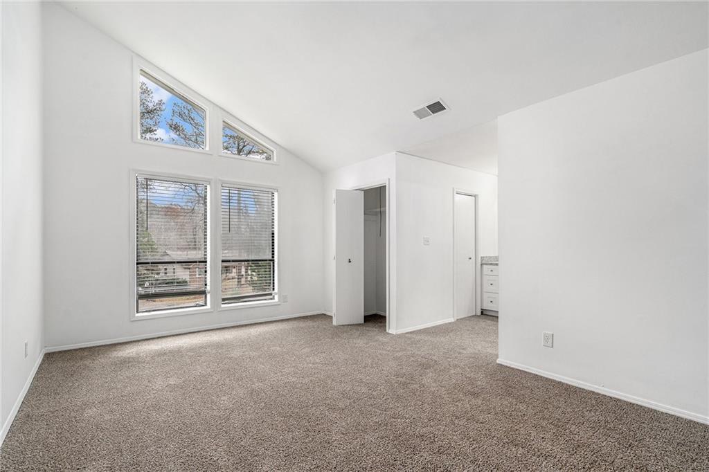 5444 Wylstream Way Norcross, GA 30093 - Photo 6 of 12 a view of an empty room with a window
