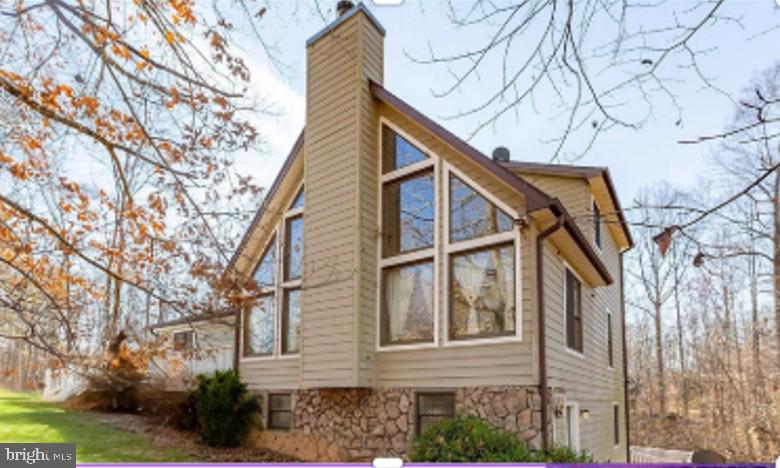 a view of a house with a snow