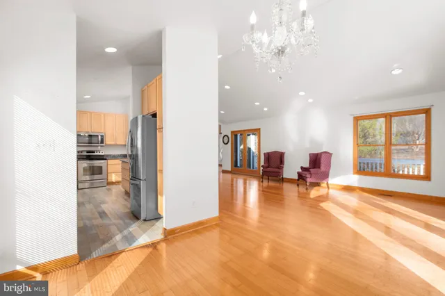 a view of a living room and chandelier or kitchen