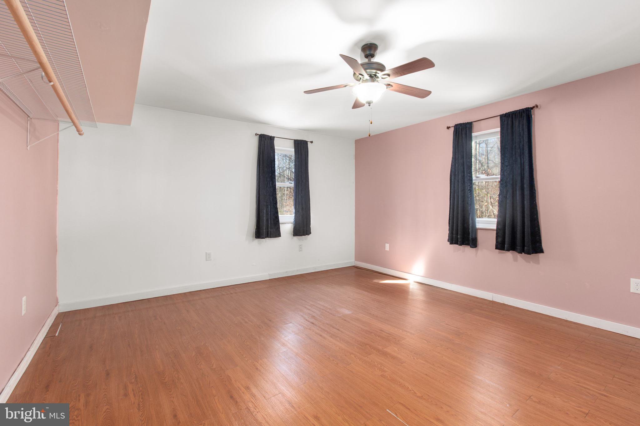 7312 Sugar Hollow Road Orange, VA 22960 - Photo 14 of 47 a view of an empty room with window and wooden floor