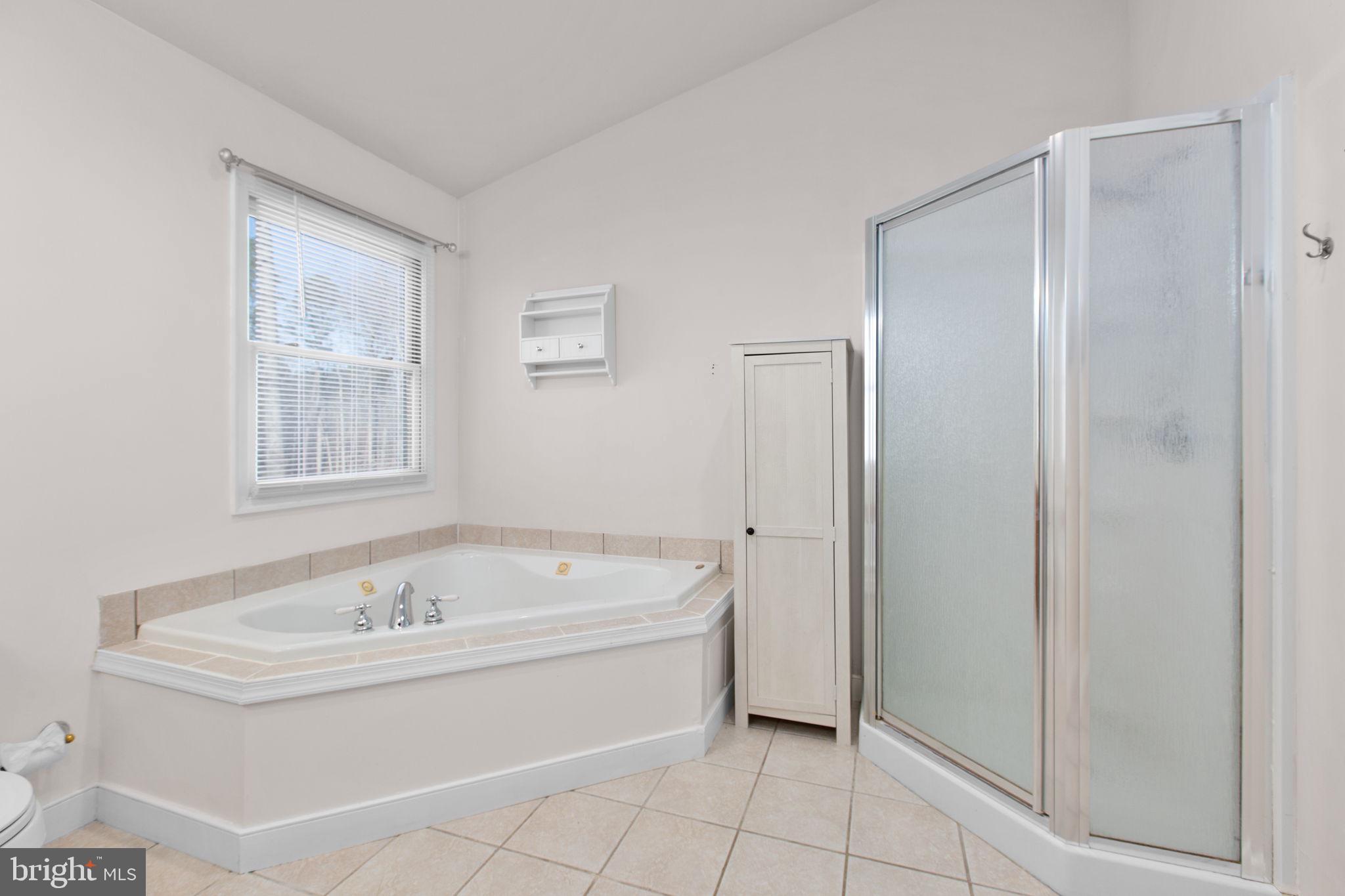 7312 Sugar Hollow Road Orange, VA 22960 - Photo 27 of 47 a white bath tub sitting next to a white sink