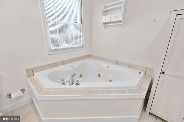a white bath tub sitting in a bathroom