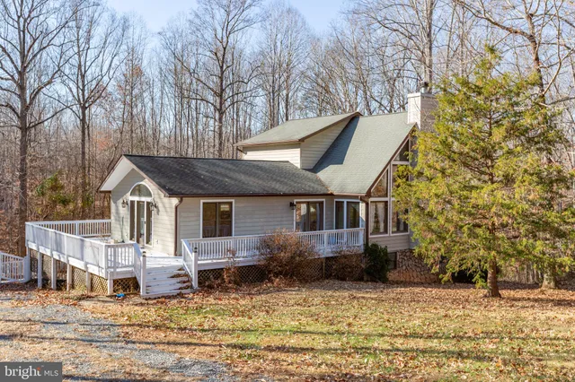 a view of a house with a snow in the yard