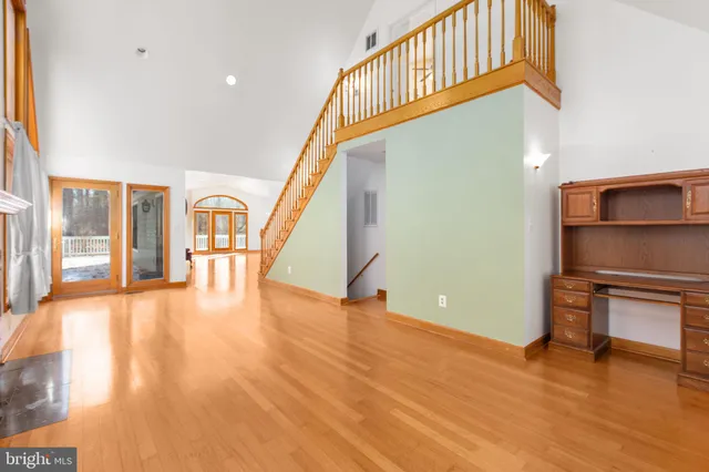 a view of an entryway with wooden floor
