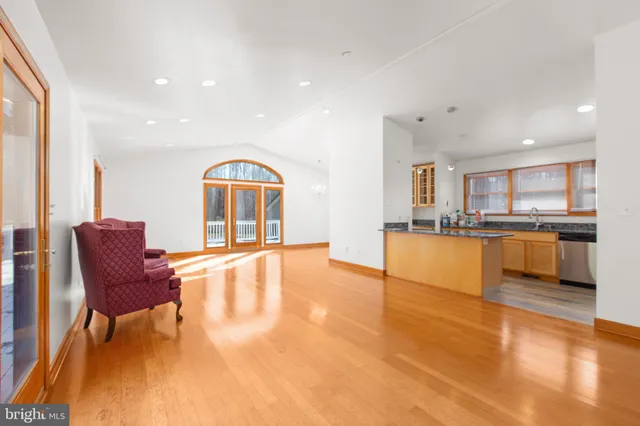 a view of a living room and kitchen with a large window