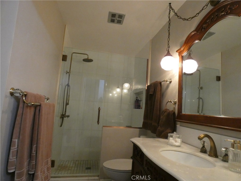 334 West Santa Elena Road Palm Springs, CA 92262 - Photo 19 of 45 a bathroom with a sink a toilet and shower