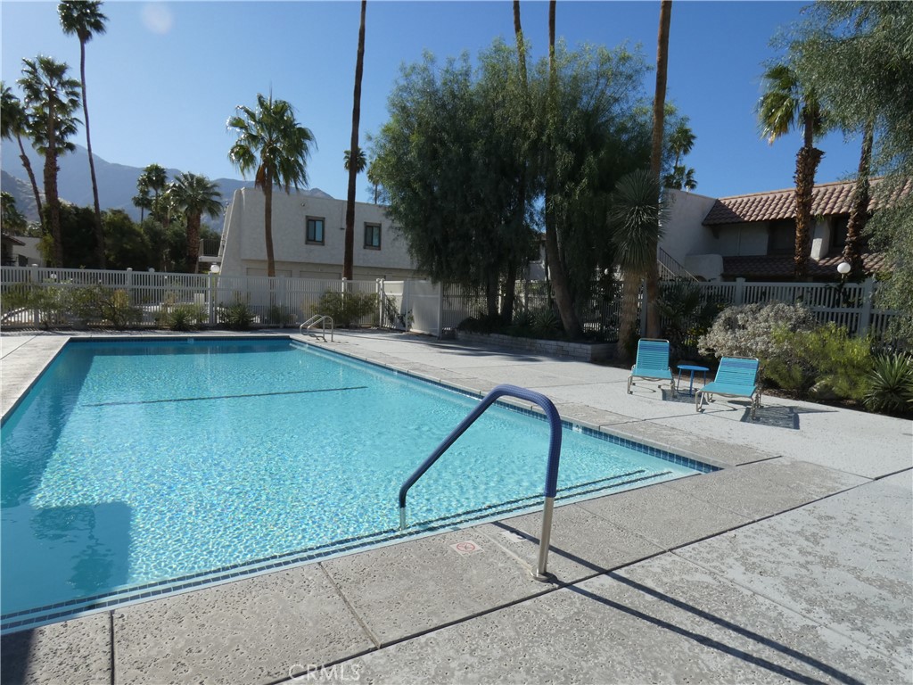 334 West Santa Elena Road Palm Springs, CA 92262 - Photo 30 of 45 a view of a tennis court with palm trees
