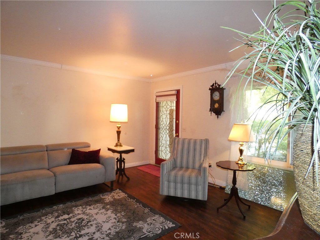 334 West Santa Elena Road Palm Springs, CA 92262 - Photo 8 of 45 a living room with furniture and a lamp