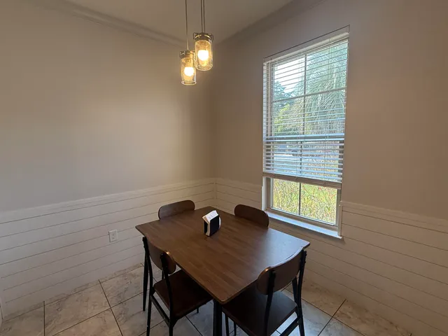 a living room with furniture a window and a fireplace