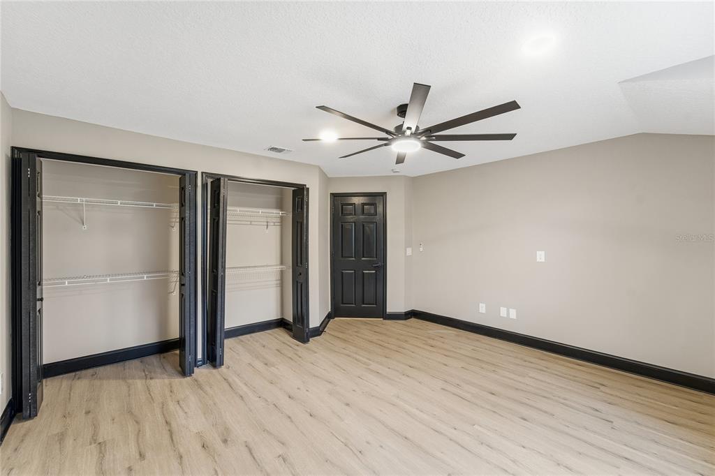 14728 Henson Road Orlando, FL 32832 - Photo 26 of 79 wooden floor in an empty room with a window