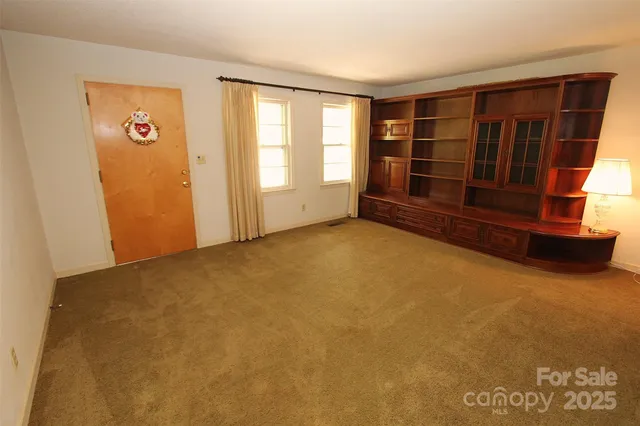 an empty room with windows