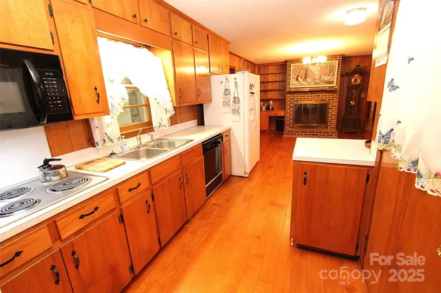 a view of a kitchen with a large window