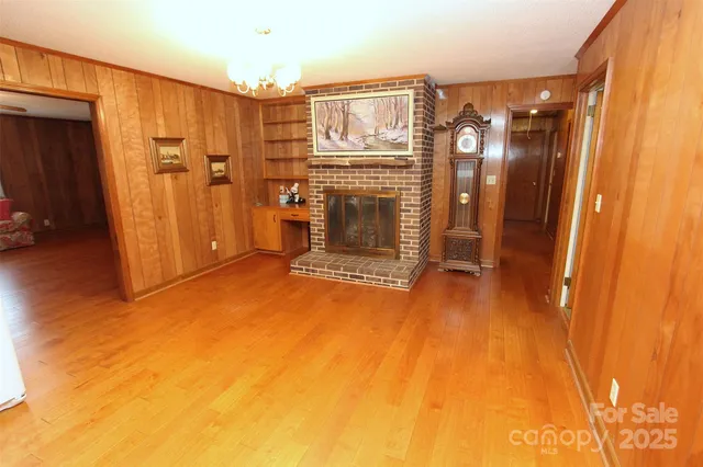 a view of a livingroom with furniture and a bathroom