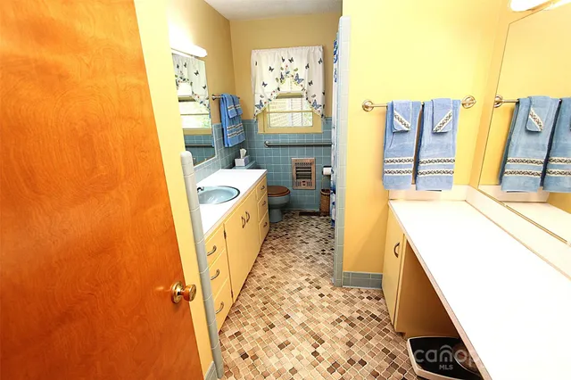 a bathroom with sink and mirror