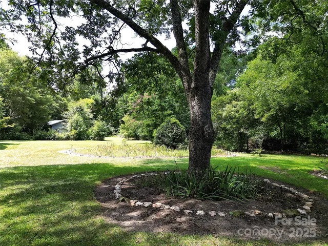 a view of grassy field with trees
