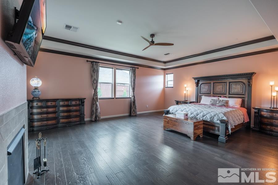 9898 Firefoot Lane Reno, NV 89521 - Photo 13 of 40 a bedroom with a bed and wooden floor