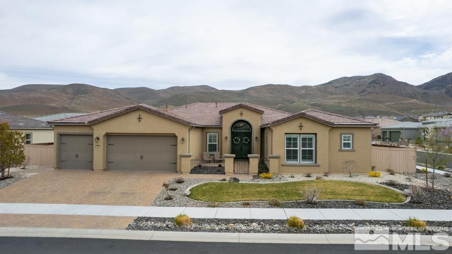9898 Firefoot Lane Reno, NV 89521 - Photo 2 of 40 a front view of a house with a yard