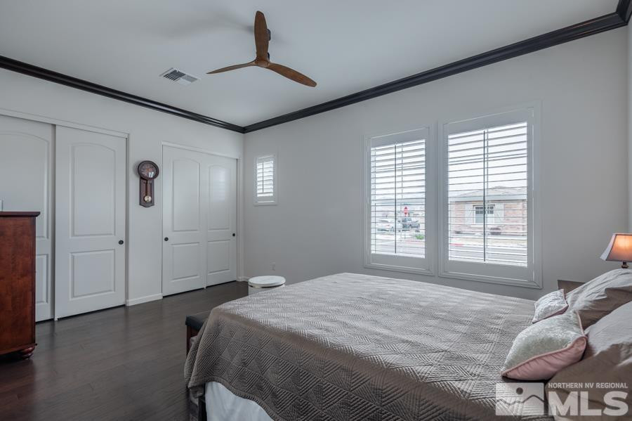 9898 Firefoot Lane Reno, NV 89521 - Photo 21 of 40 a spacious bedroom with a bed and a window