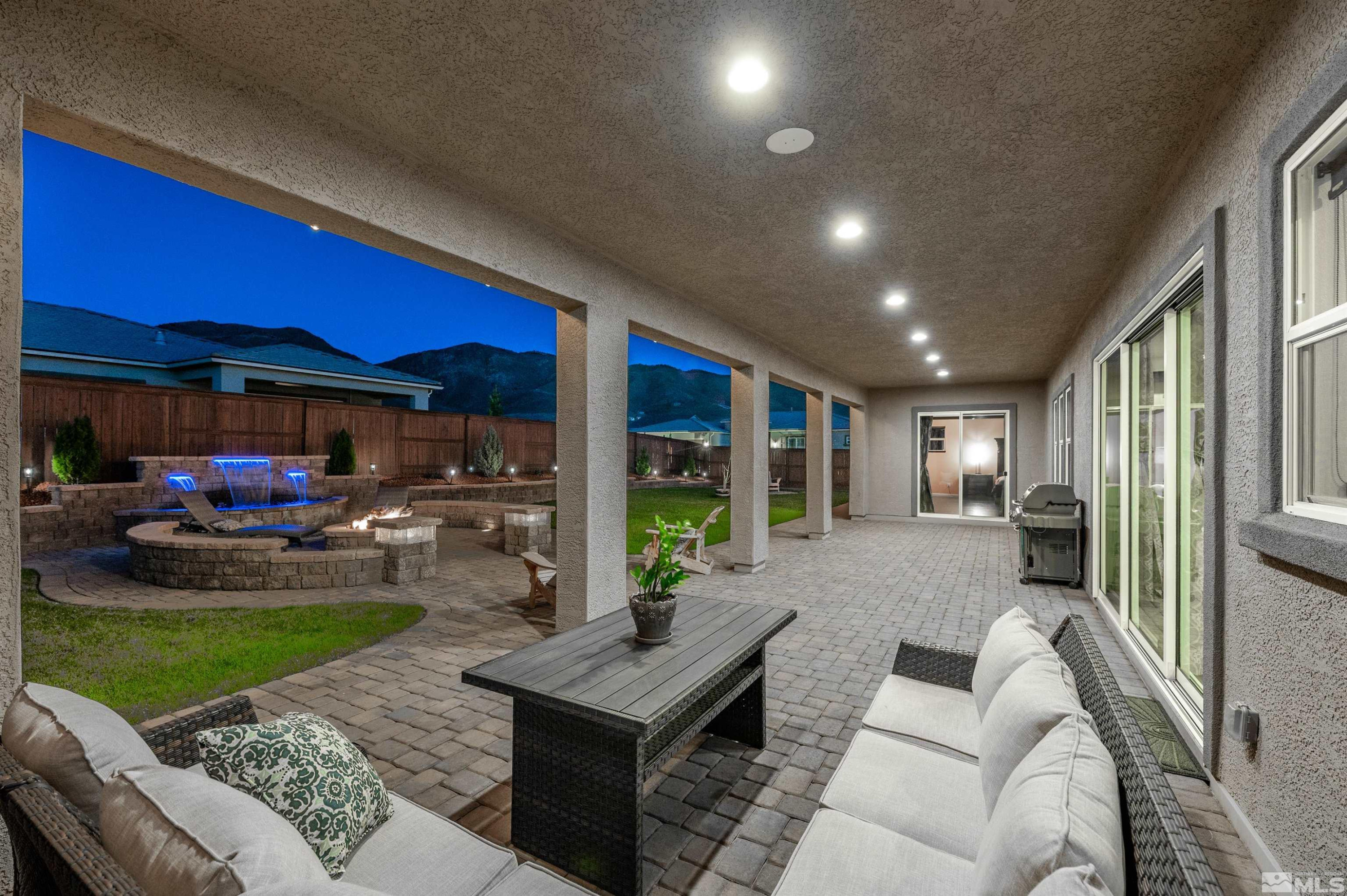 9898 Firefoot Lane Reno, NV 89521 - Photo 24 of 40 a living room with furniture a window and a table