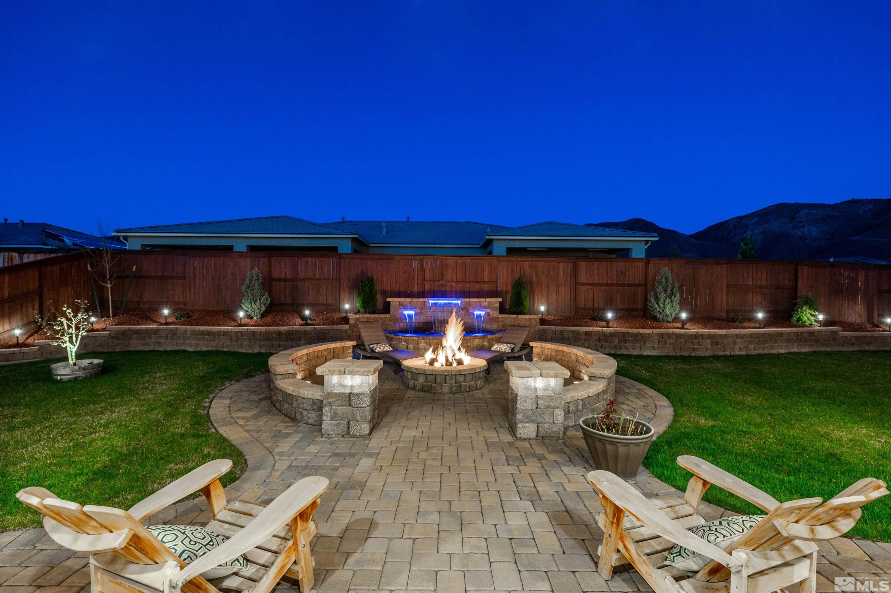 9898 Firefoot Lane Reno, NV 89521 - Photo 25 of 40 a view of a patio with chairs and a table