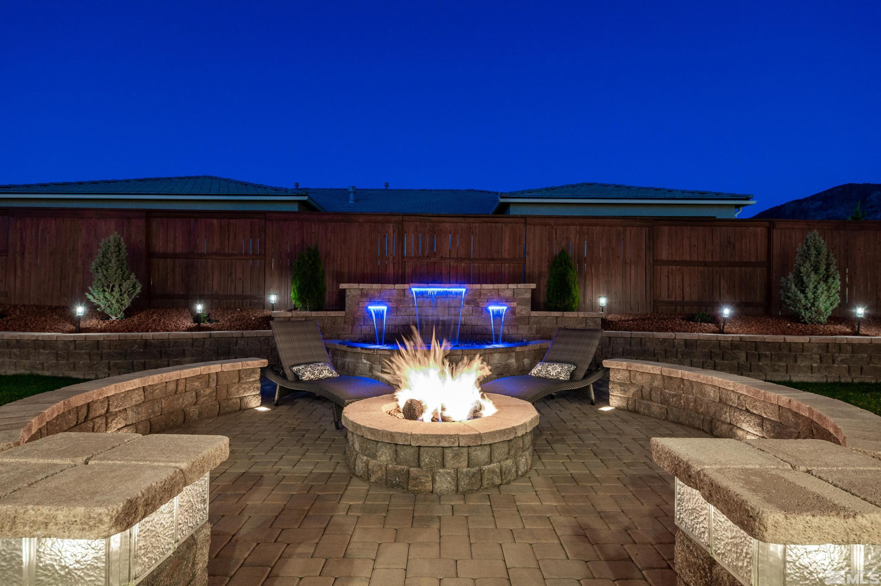 9898 Firefoot Lane Reno, NV 89521 - Photo 26 of 40 a living room with furniture and a fireplace
