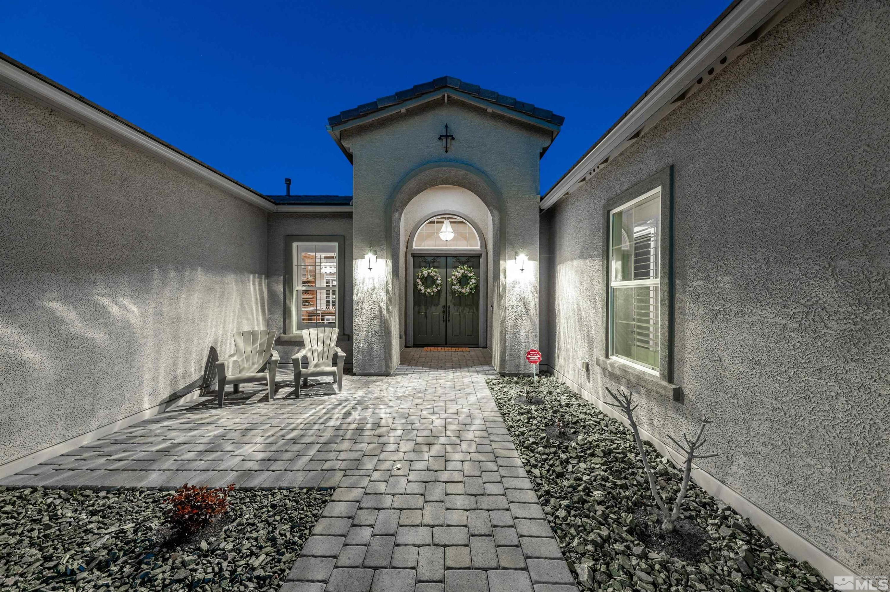 9898 Firefoot Lane Reno, NV 89521 - Photo 3 of 40 a front view of a house with a yard