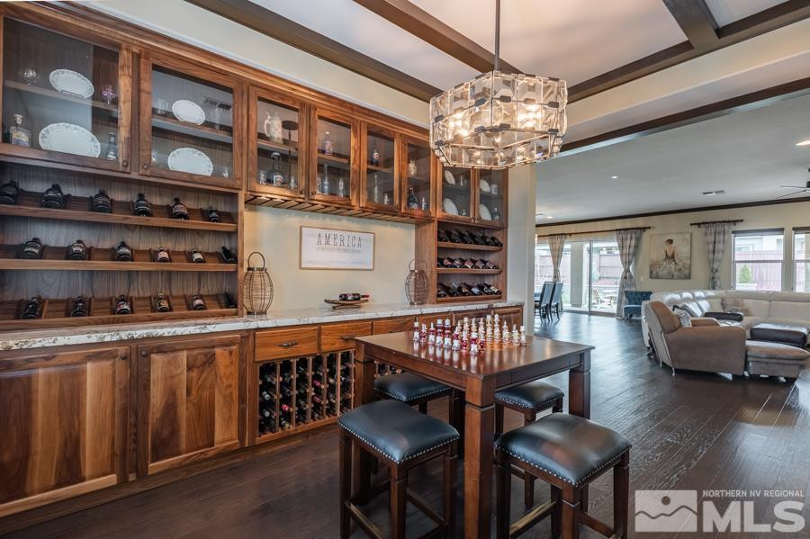 9898 Firefoot Lane Reno, NV 89521 - Photo 7 of 40 a view of a dining room with furniture wooden floor and chandelier